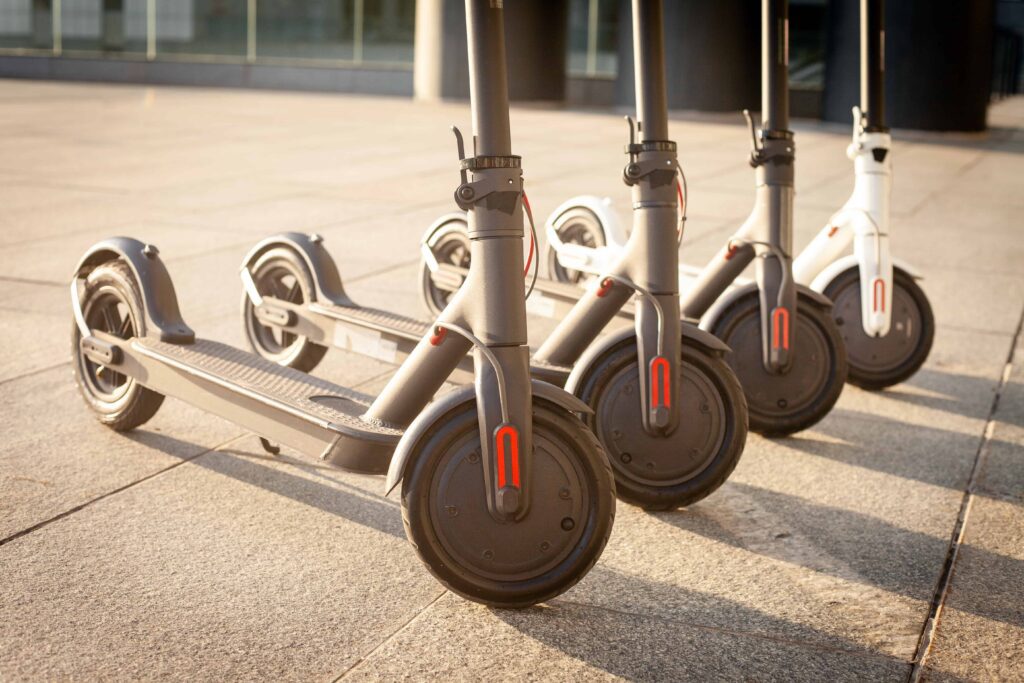 Embedos_electric-scooters-stand-street-against-background-city